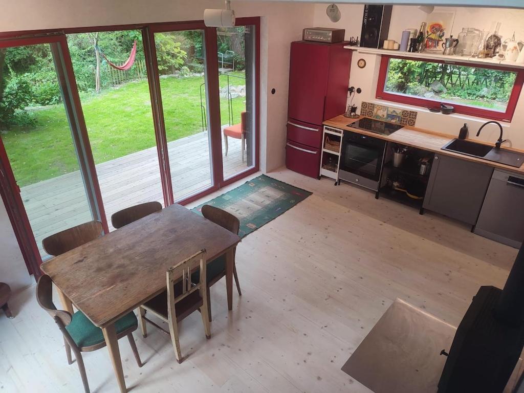 a kitchen with a table and chairs in a room at Romantický domek Slapy in Brunšov