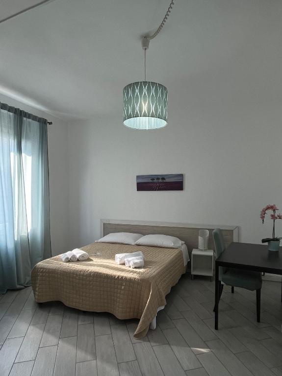 Una cama o camas en una habitación de Easy Rooms Suite