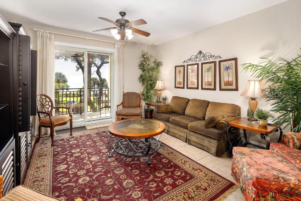 a living room with a couch and a table at 760 Ocean Blvd #204 in Saint Simons