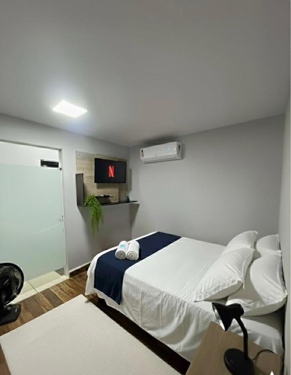 Postel nebo postele na pokoji v ubytování Loft privativo prox. Shopping