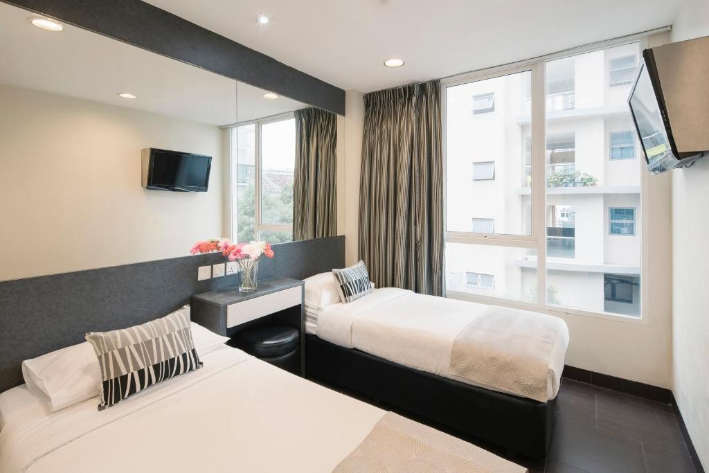Postel nebo postele na pokoji v ubytování Value Hotel Nice
