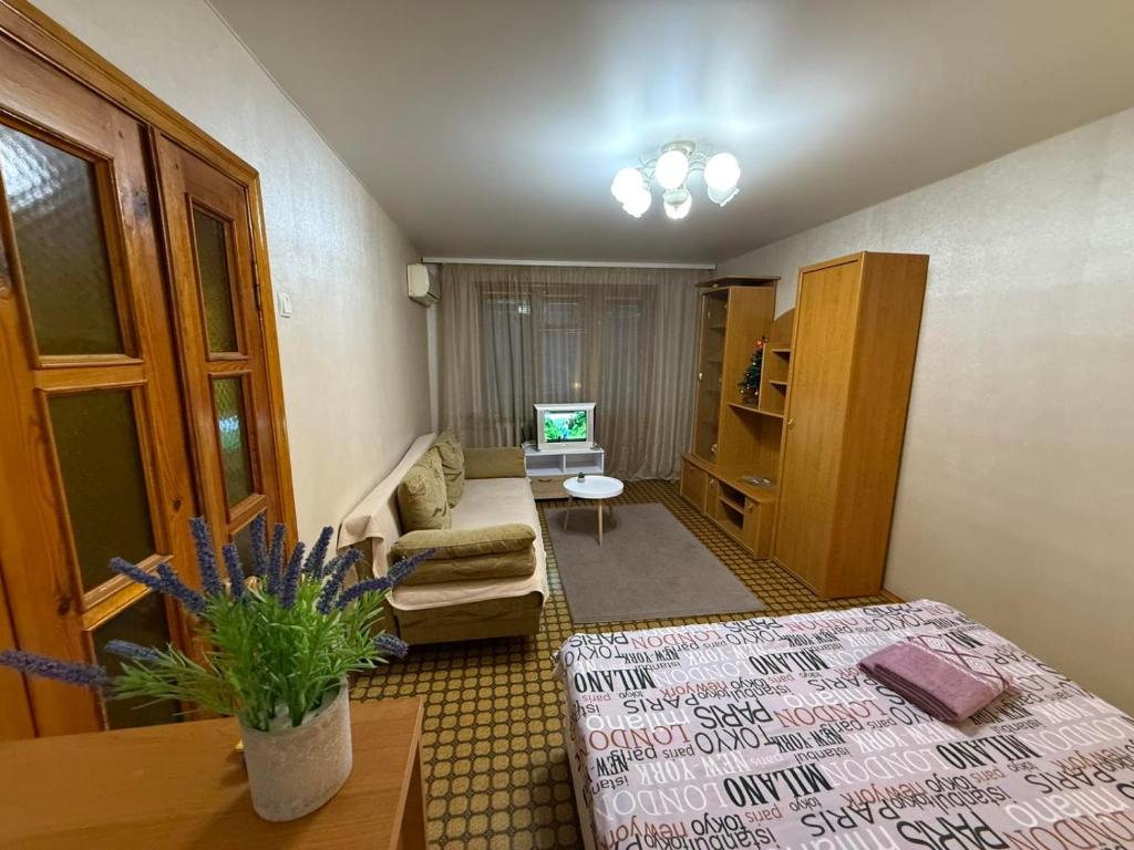 a living room with a couch and a table at Суворова-Титова in Dnipro