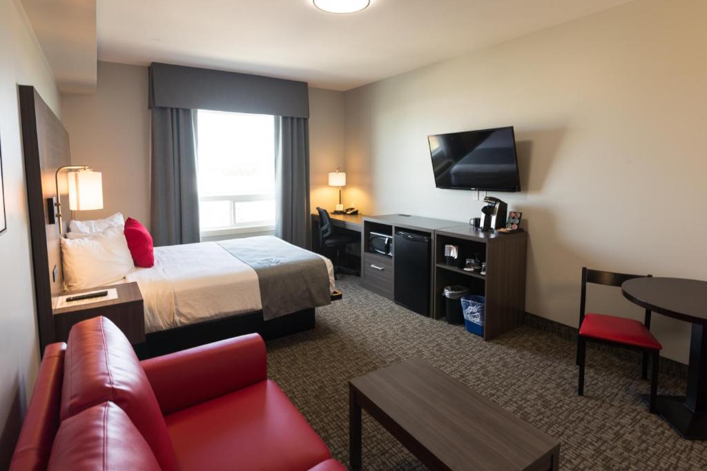 Ein Bett oder Betten in einem Zimmer der Unterkunft Kanata Whitecourt