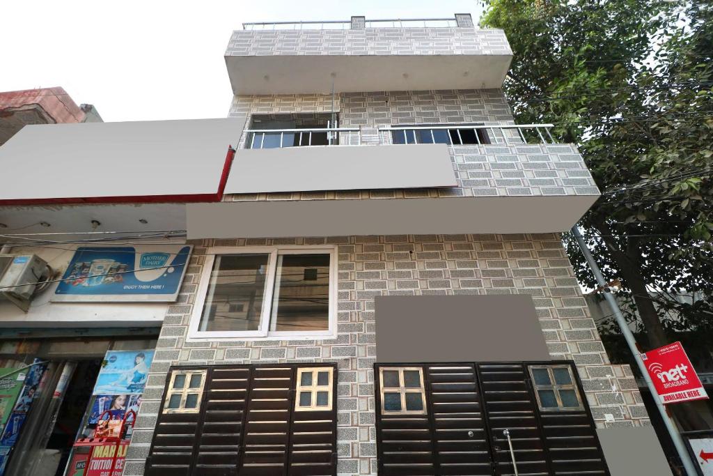 a building with a lot of windows on it at Hotel O Max in Jalandhar