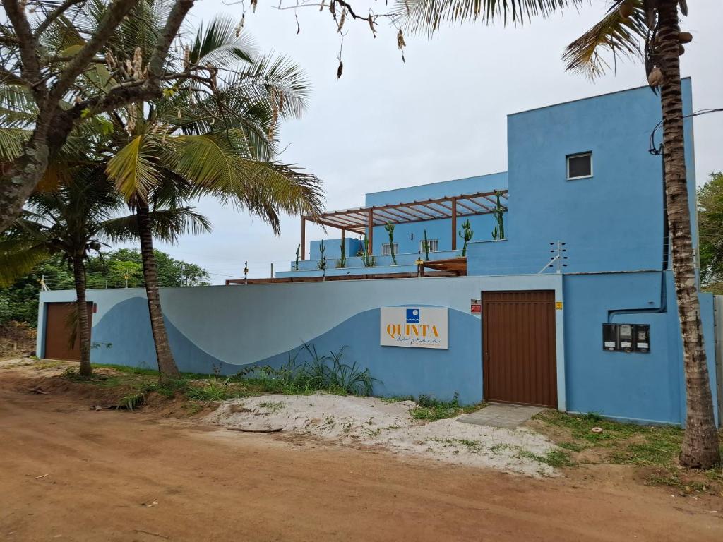 a blue building with a sign that reads winemia at Quinta da Praia in Serra
