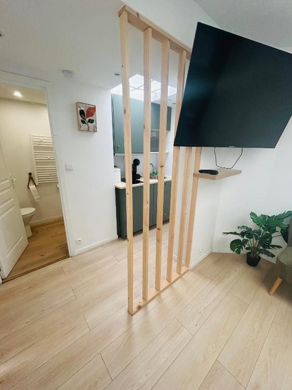 a living room with a large mirror on the wall at Green Love Suite in Tourcoing