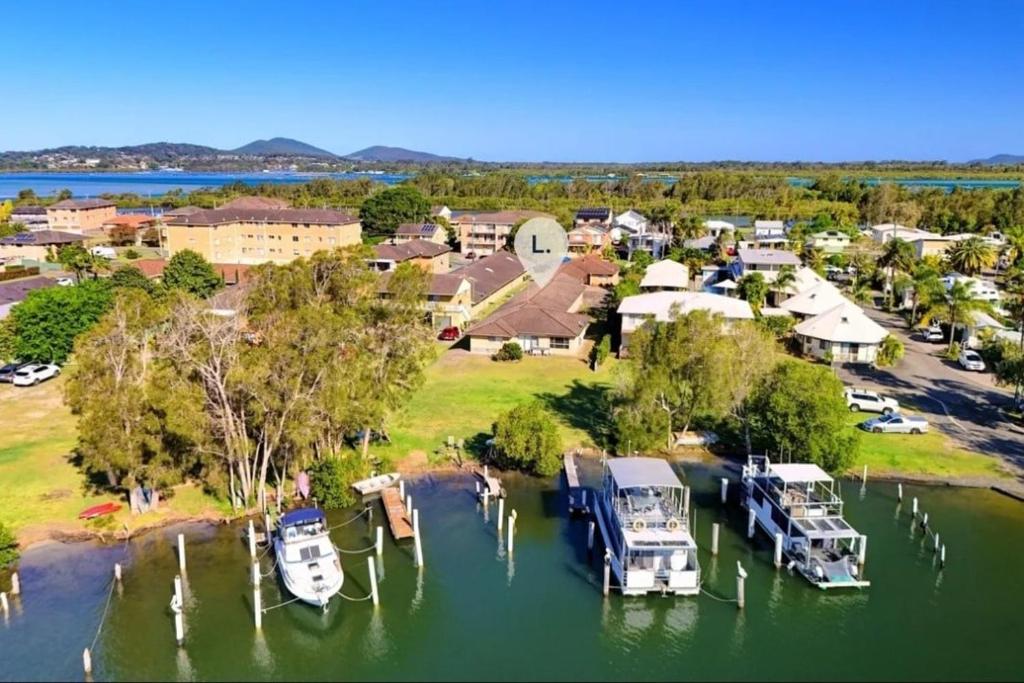an aerial view of a marina with boats in the water at Tuncurry 2BR Walk to Lake in Tuncurry