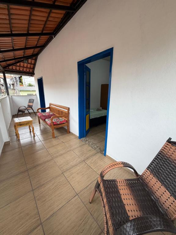 a living room with a couch and a chair at Villa Jardineira in Ouro Preto