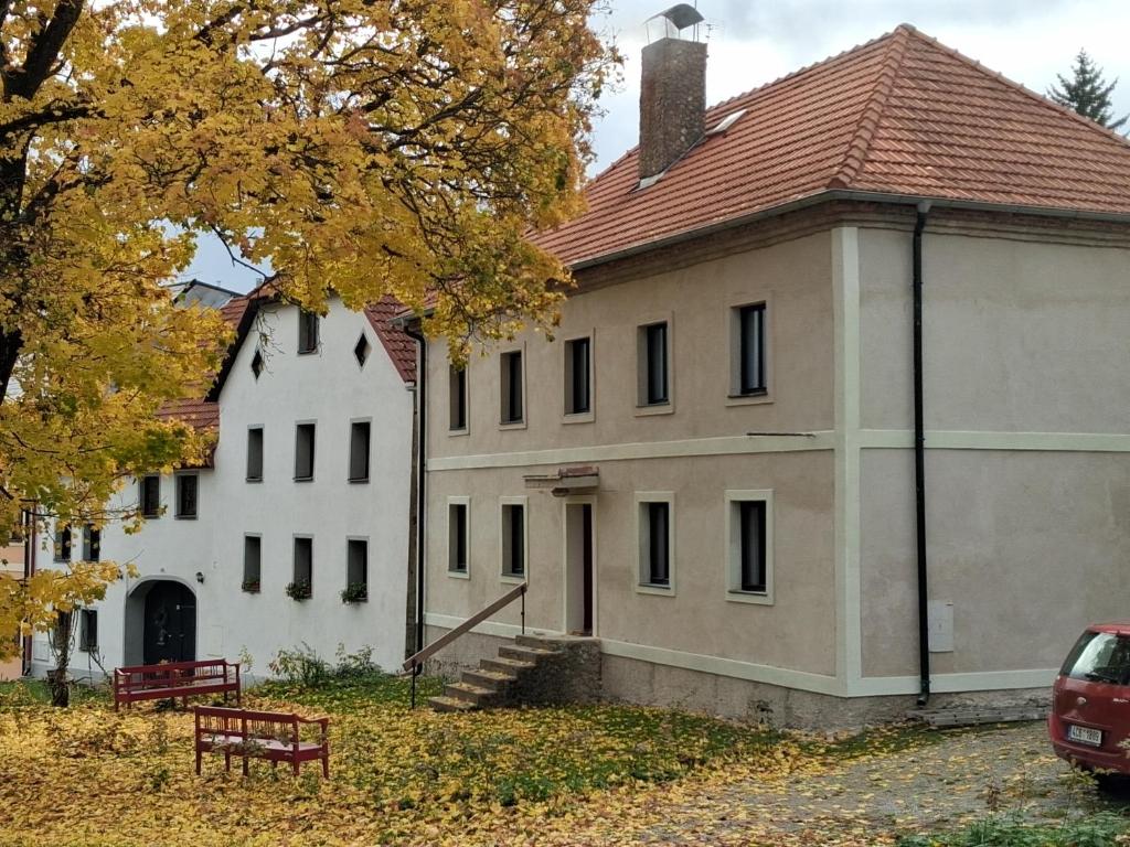 a large white building with a roof at Chalupa Vagner, Pernek in Horní Planá