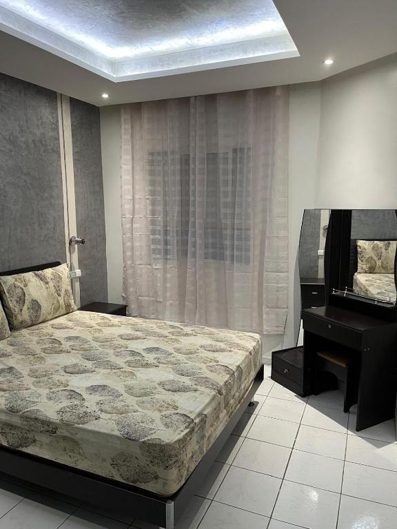 a bedroom with a bed and a piano at Airport Premium Apartment - 15 min to Rabat City Center in Salé