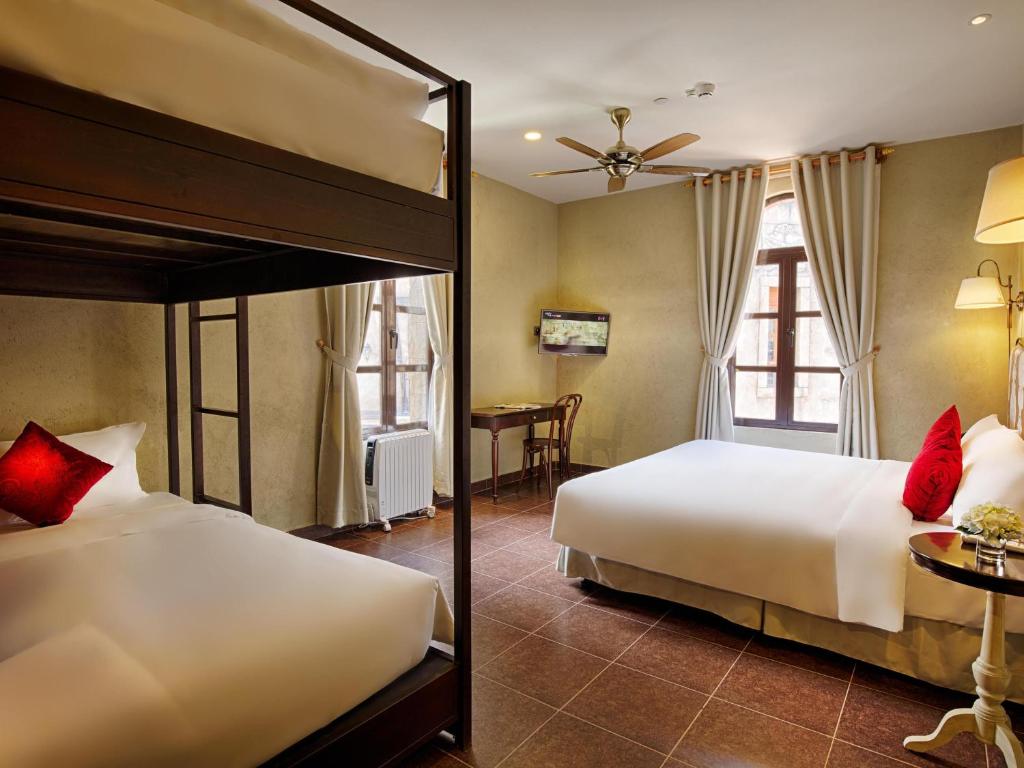 Family Deluxe Room with One King Bed and One Single Bed
