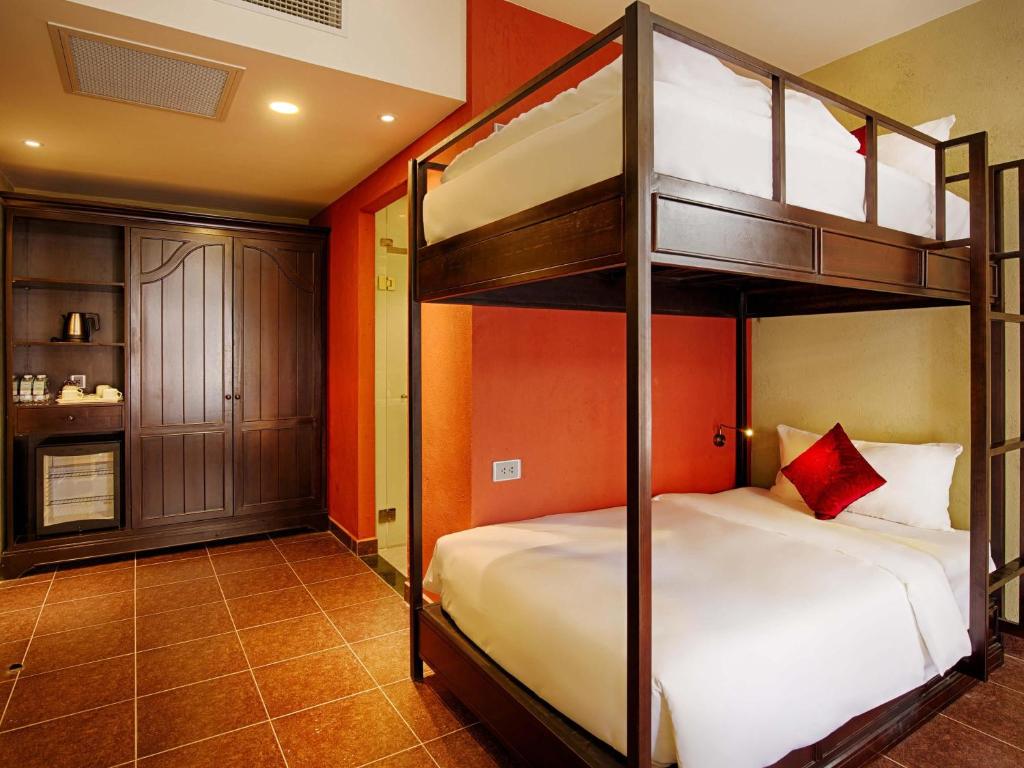 Family Deluxe Room with One King Bed and One Single Bed