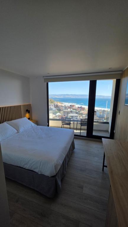 Ένα ή περισσότερα κρεβάτια σε δωμάτιο στο Arka Hotel
