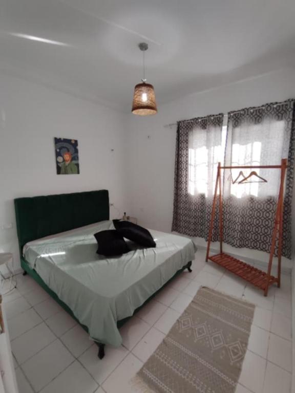 Ένα ή περισσότερα κρεβάτια σε δωμάτιο στο La Maison des Cœurs - Appart Chic