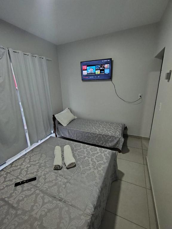 Ένα ή περισσότερα κρεβάτια σε δωμάτιο στο Pousada Bella Praia