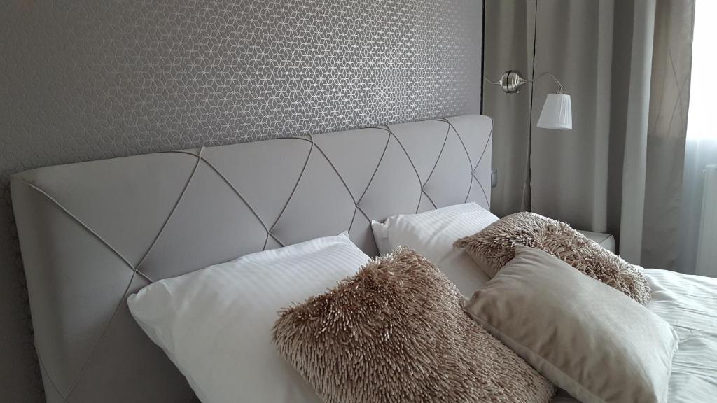 Posteľ alebo postele v izbe v ubytovaní Lake Apartment