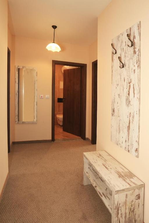 a room with a bench and a painting on the wall at Paraiso Theopolis - All Inclusive in Obzor
