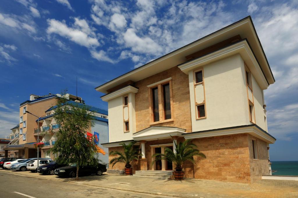 a building on the side of a street at Paraiso Theopolis - All Inclusive in Obzor