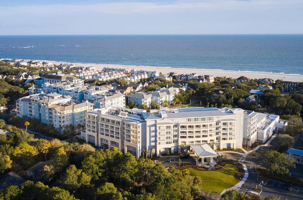 an aerial view of a large white building next to the beach at Wild Dunes Resort - Sweetgrass Inn and Boardwalk Inn in Isle of Palms