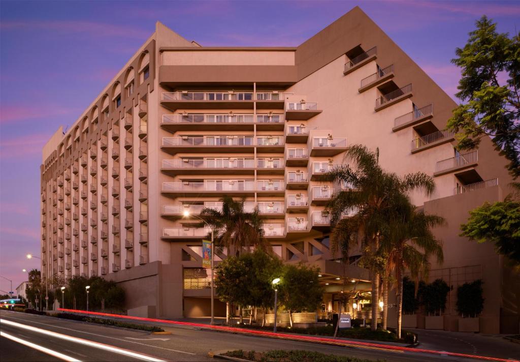 a large building with a street in front of it at Hyatt Centric Delfina Santa Monica in Los Angeles