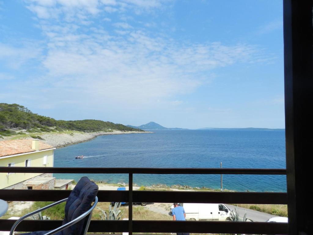 a view of the ocean from a balcony at Apartment Marika in Mali Lošinj