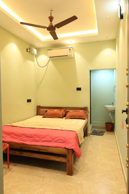 Postel nebo postele na pokoji v ubytování Le Sunrise Residency