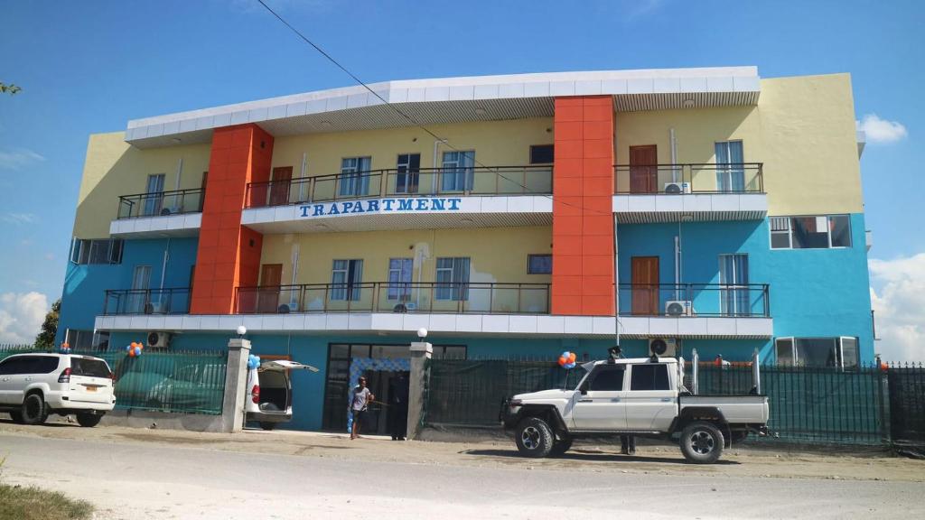 a truck parked in front of a building at TR Apartment in Honiara