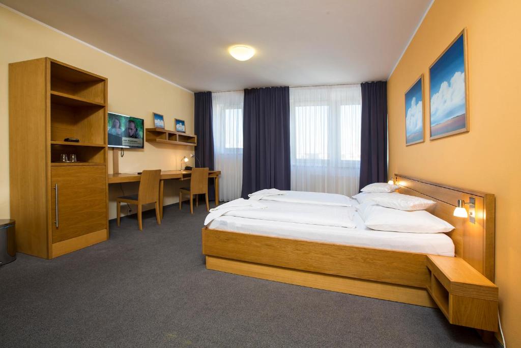Postel nebo postele na pokoji v ubytování Hotel Trend