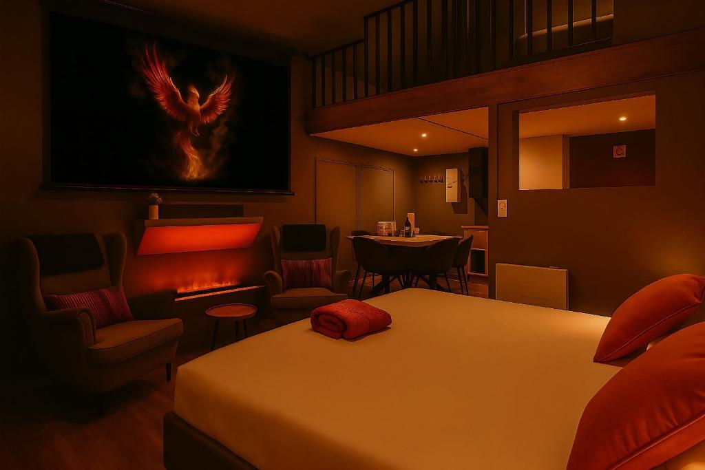 Posezení v ubytování Suite Phoenix avec Cheminée, Terrasse et Videoprojecteur