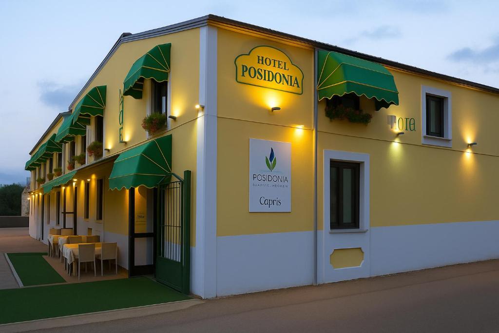 a building with a sign on the side of it at Hotel Poseidonia in Sapri