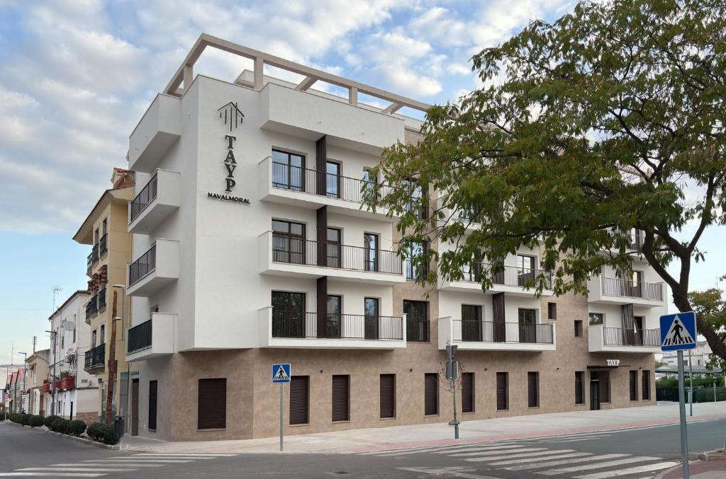a large white building on the side of a street at TAYP Navalmoral in Navalmoral de la Mata