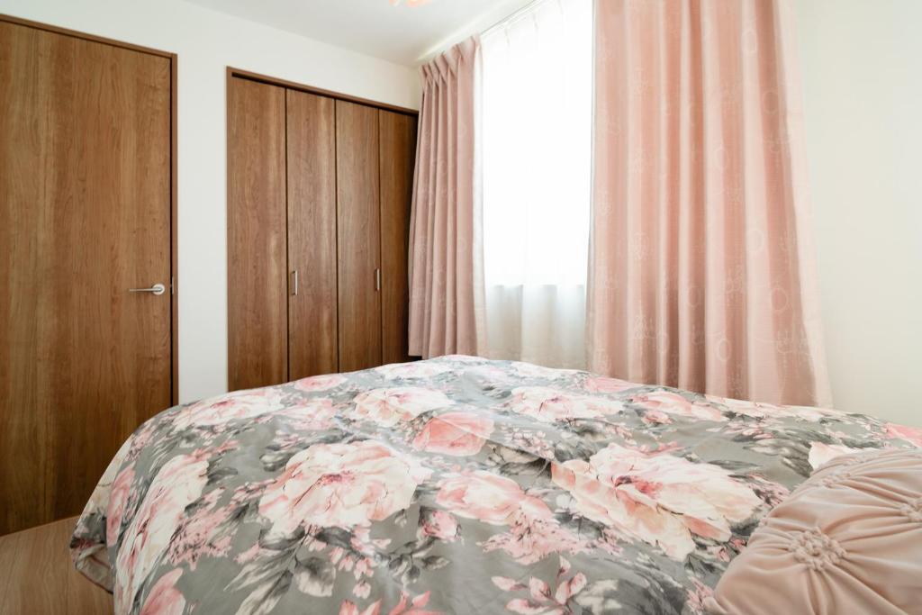 Postel nebo postele na pokoji v ubytování 东京台东区三之轮独栋别墅