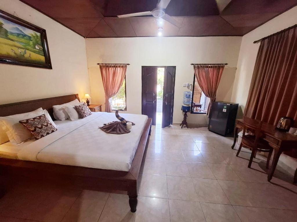 Una cama o camas en una habitación de Happy Inn 2