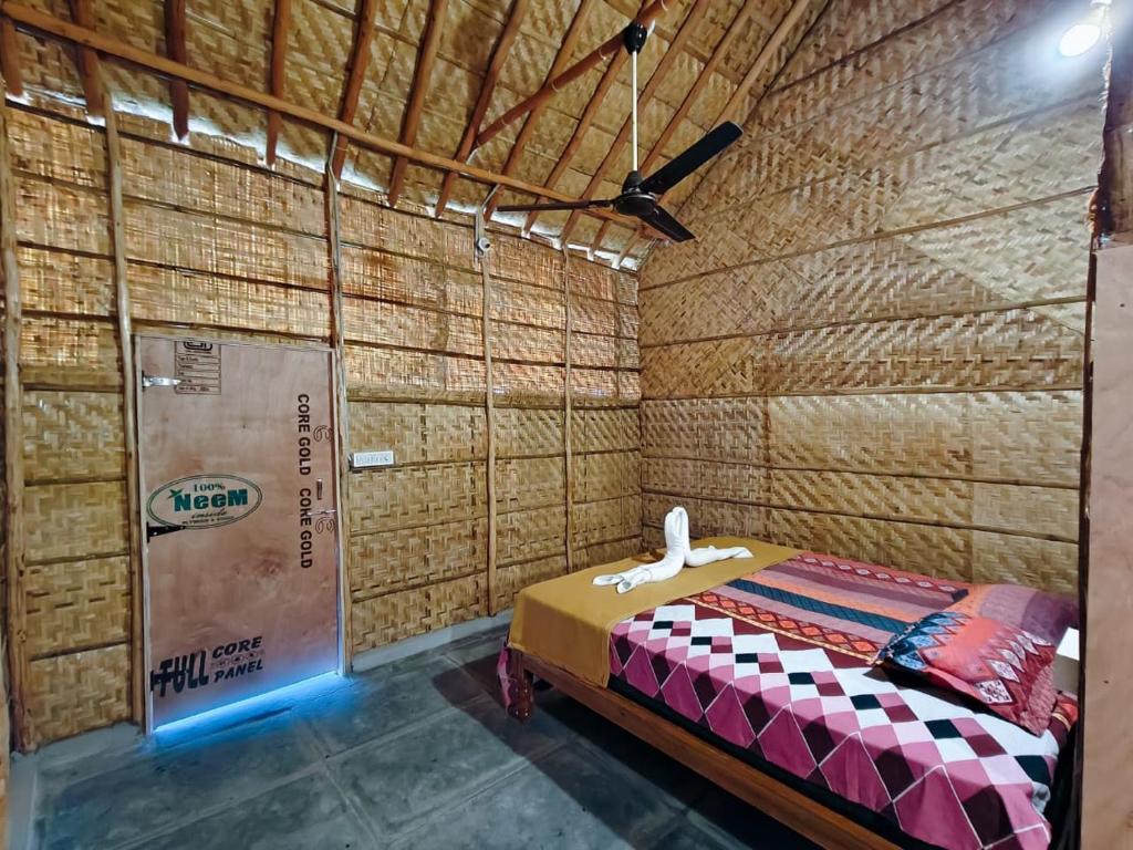 Un ou plusieurs lits dans un hébergement de l'établissement The Sundown Hampi