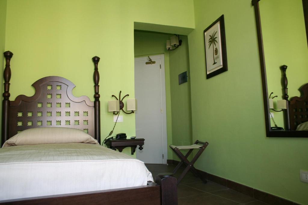 Postel nebo postele na pokoji v ubytování Hotel dei Coloniali