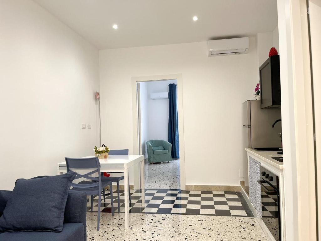 a living room with a couch and a table at Palermo central stay in Palermo