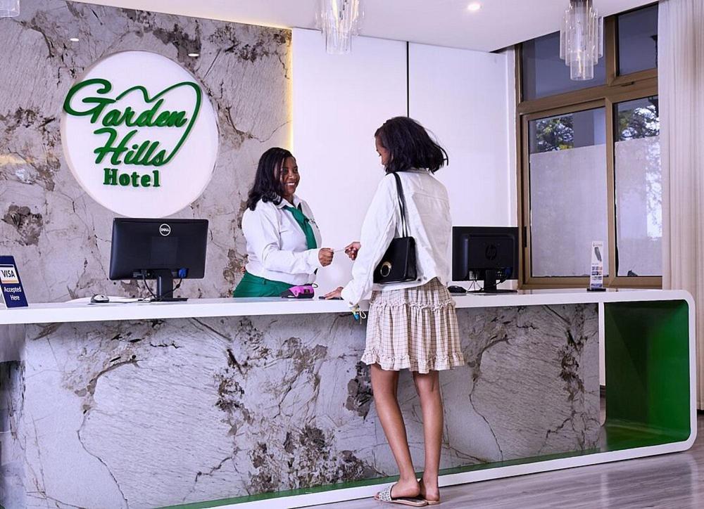 two women standing at a counter in a salon at Garden Hills Hotel in Addis Ababa