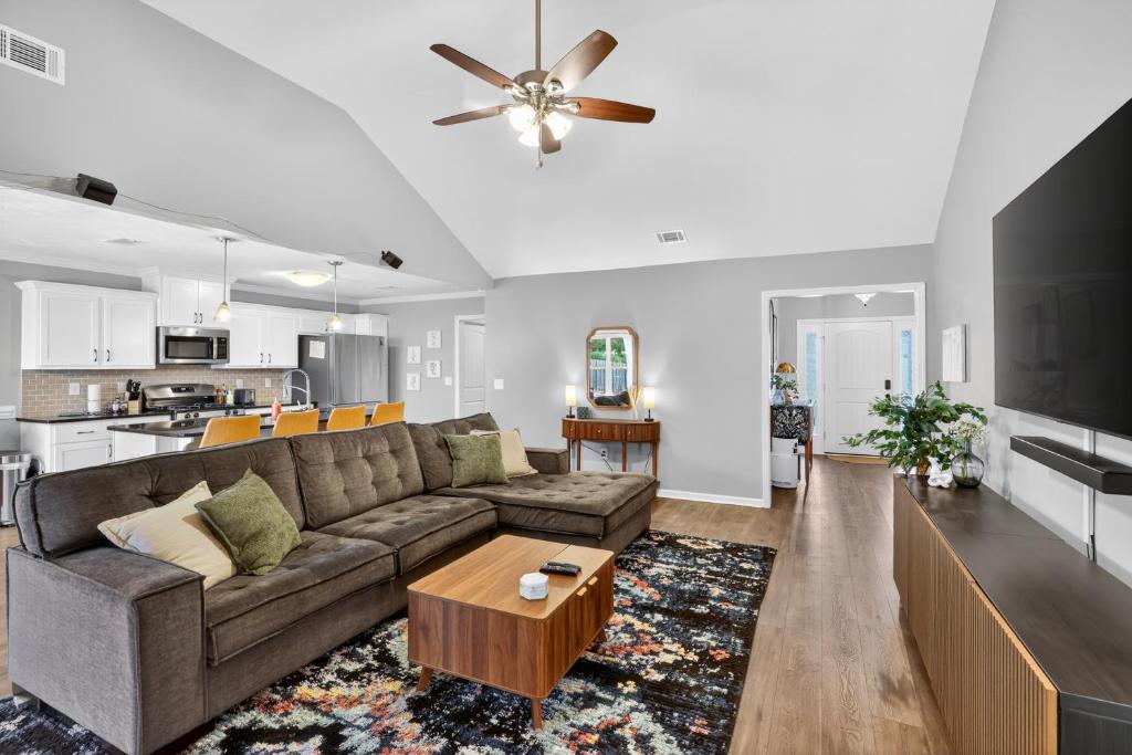 a living room with a couch and a table at Peaceful Family Retreat Near Augusta home in Warrenville