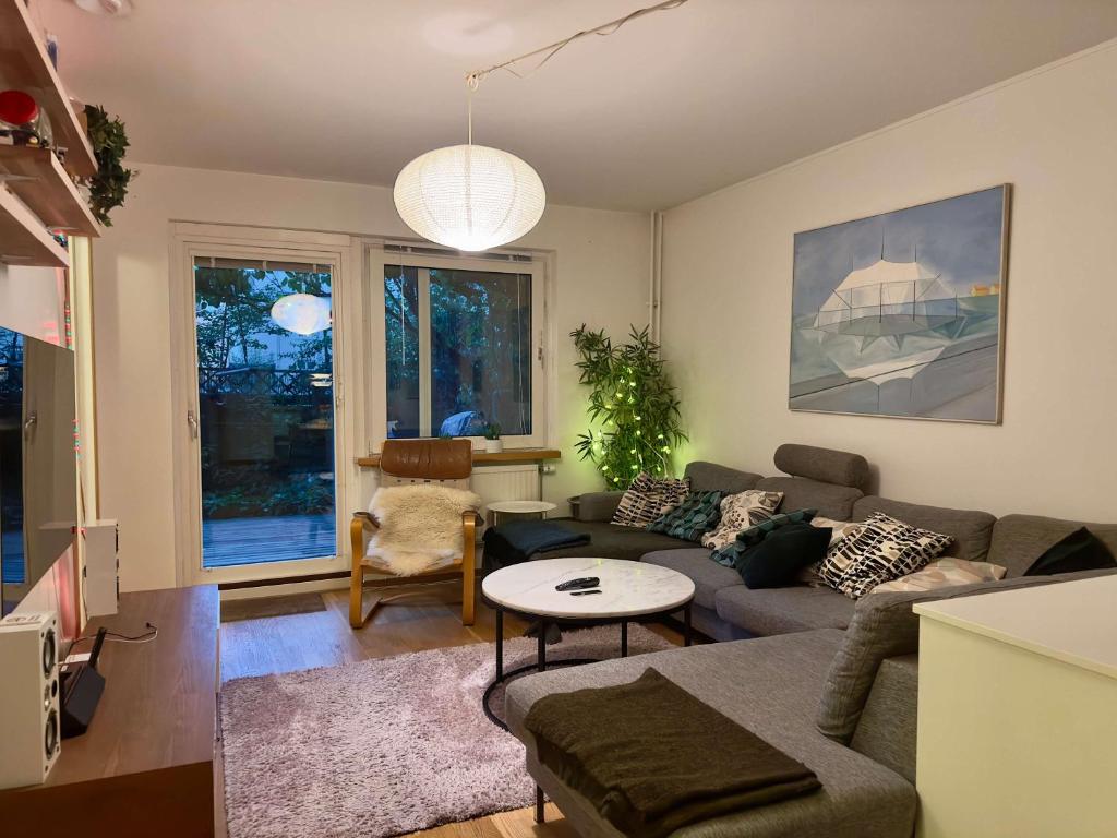 a living room with a couch and a table at Spacious Apartment in Sodermalm in Stockholm