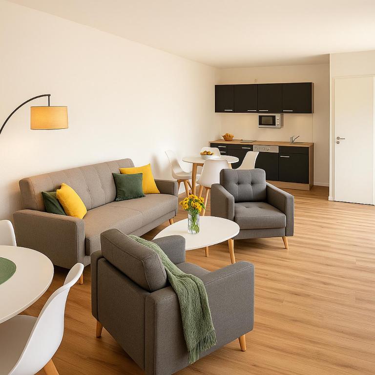 a living room with a couch and chairs and tables at Dat Fischerhuus in Pruchten