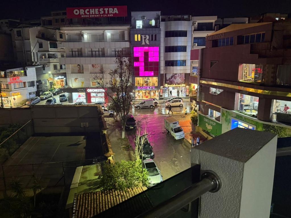 a view of a city at night with cars on the street at Résidence montana in Deli Ibrahim