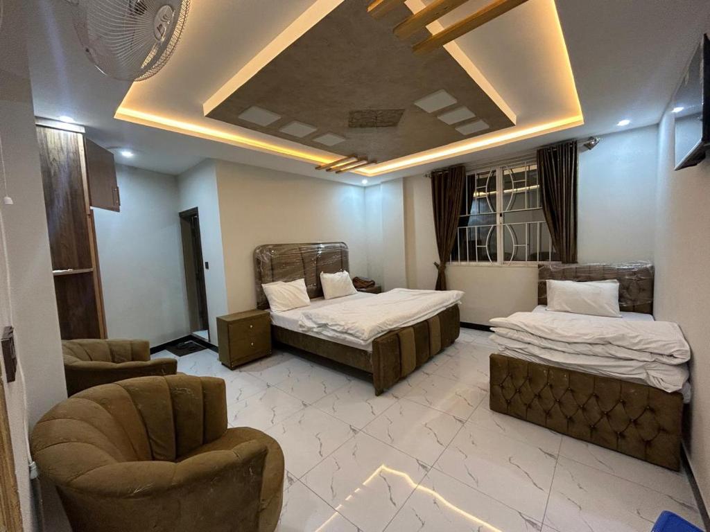 Ένα ή περισσότερα κρεβάτια σε δωμάτιο στο askari lodges