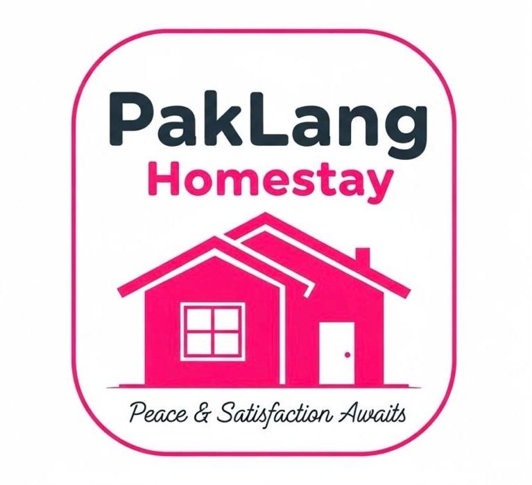 a logo for a home warranty on a house at Pak Lang Homestay in Kampung Gurun
