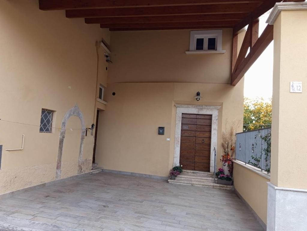 a side view of a house with a door at Dimora Visconti in San Demetrio neʼ Vestini