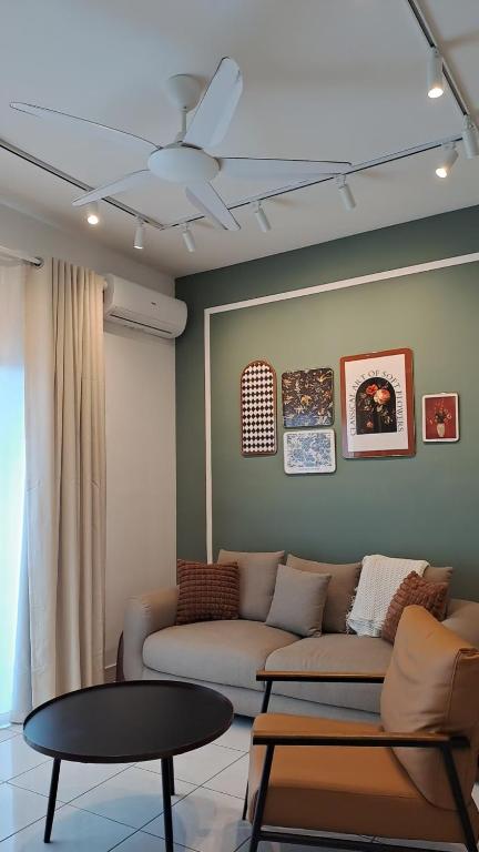 a living room with a couch and a table at Youth City Residence, Nilai 2R2B in Nilai