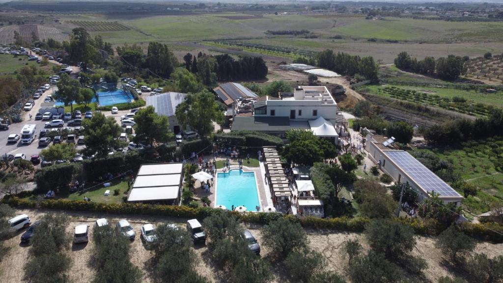 an aerial view of a resort with a pool and parking lot at Agriturismo Vultaggio in Guarrato
