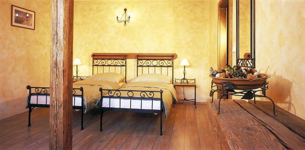 Postel nebo postele na pokoji v ubytování Hotel Via Ironia