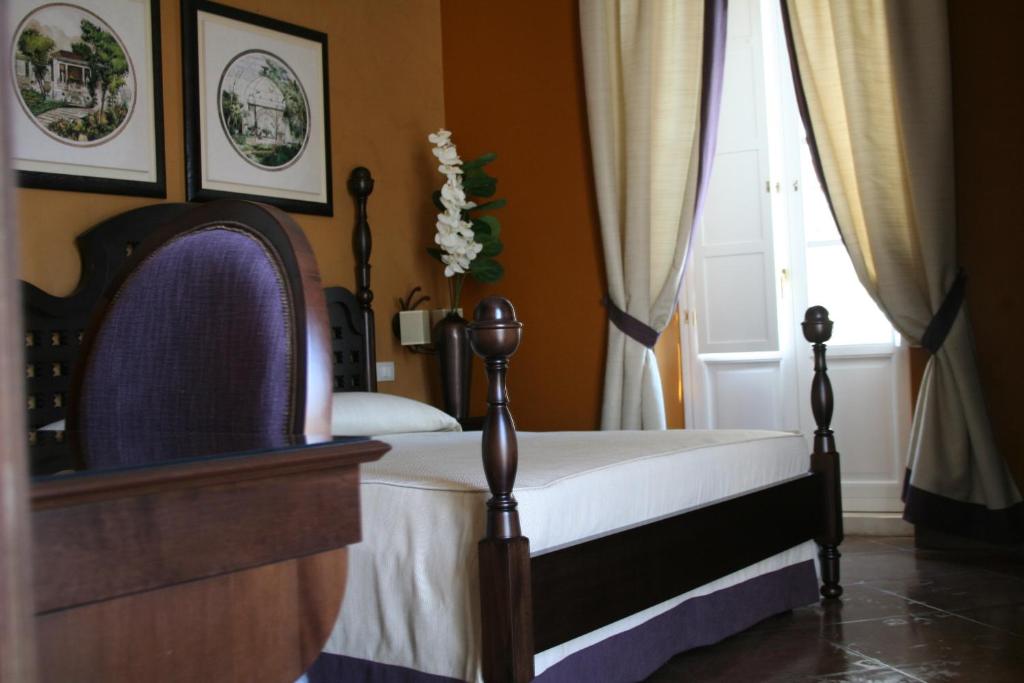 Postel nebo postele na pokoji v ubytování Hotel dei Coloniali