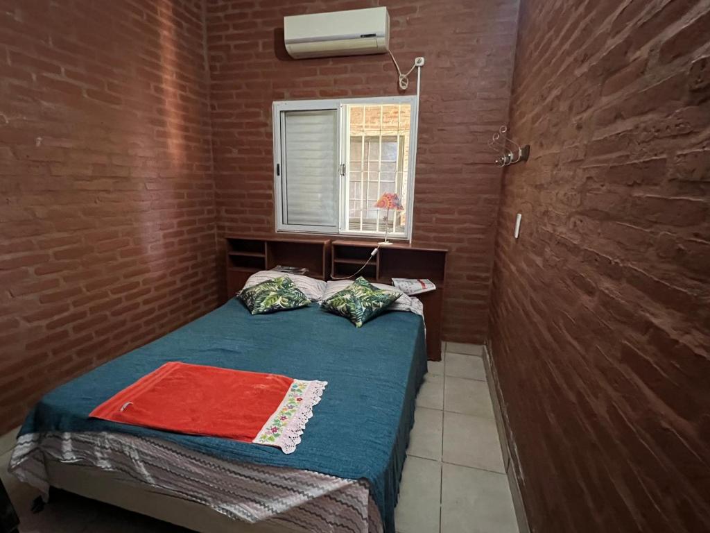 Postel nebo postele na pokoji v ubytování Casaquinta en Corrientes con Pileta