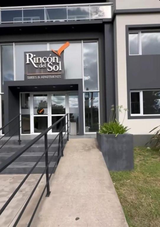 a building with a sign on the front of it at Suite Rincon del Sol in Pinamar